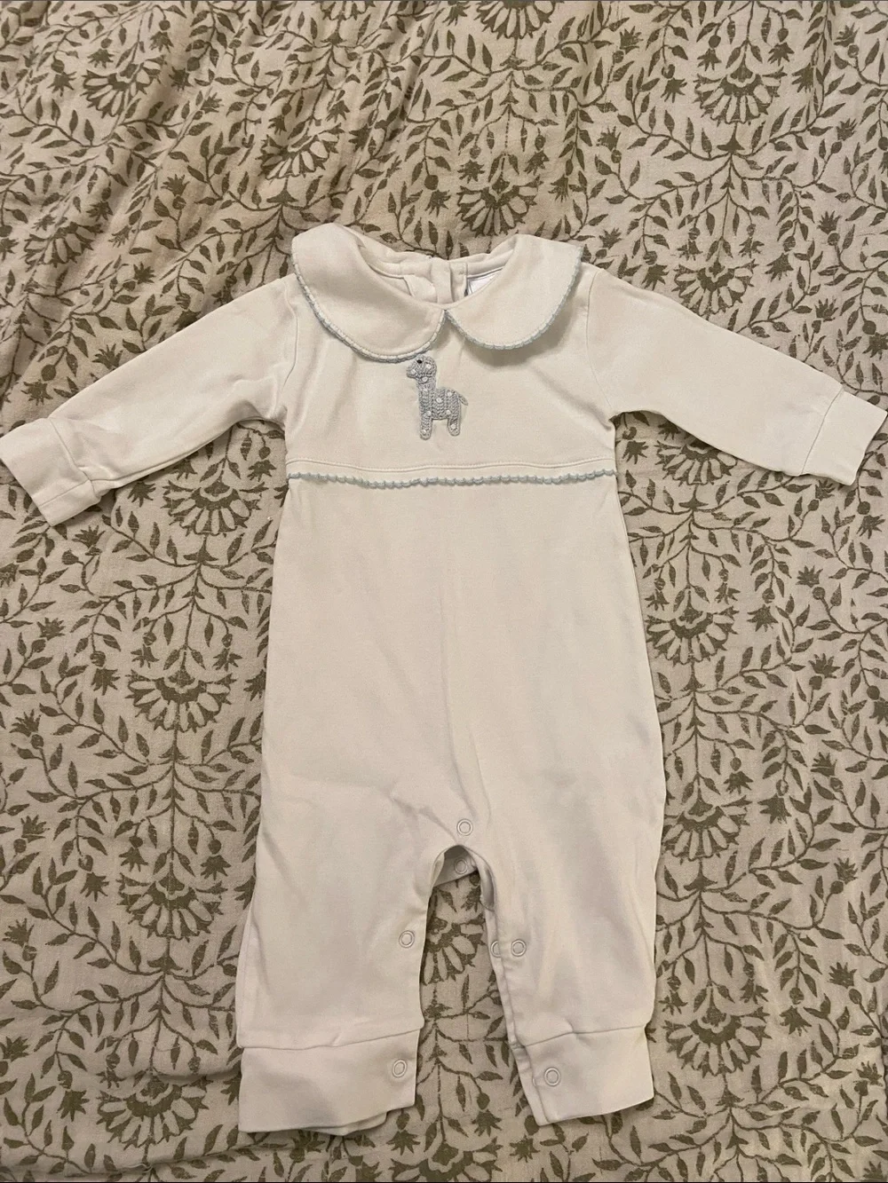 Playsuit with light blue crocheted giraffe